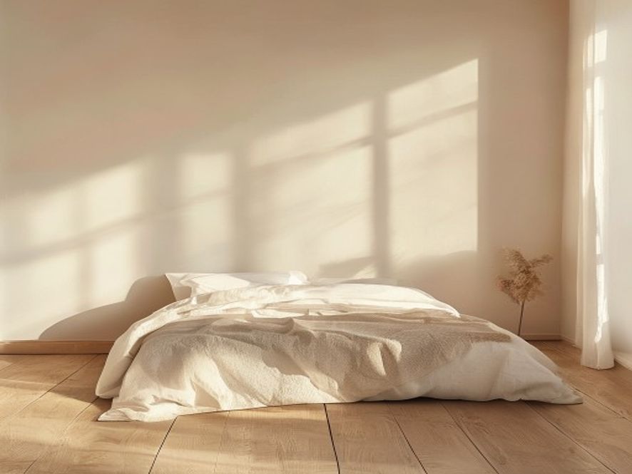 Soft morning light illuminating a minimalist bedroom with an open window showing early dawn